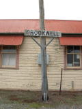 Crookwell sign on the road side of Crookwell railway station.