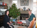 Mum and Dad about to open Christmas presents.