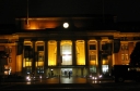 Wellington Railway Station at night. A late night passenger approaches the front steps.