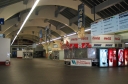 Another view of the main lobby of Wellington Railway Station. The signs on the right hand side point towards the platforms.