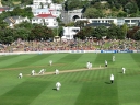 A tail-order New Zealand batsman competently defends his first delivery at the Basin Reserve, Wellington. In the background is the Mount Victoria tunnel.