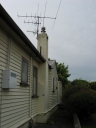 The eastern side of the house, including antennas for TV1, TV2, TV3, TV4, Prime, and Trackside.