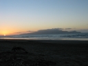 The sun has almost finished setting next to Kapiti Island.
