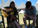 Snaiet and Haydn sing harmonies under a tree at the Sand Castle Motel.