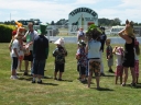 Judging of the crazy hats competition continues. The finishing post at Tauherenikau is clearly shown in the background.