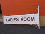 Sign for the ladies room at Michelago, currently on the ground.