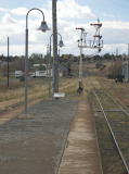 The northern end of Cooma platform, the main signals north, and the cutting north of Cooma station.