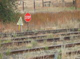 A stop sign on the eastern line passing the station. Ground work at the northern end of the barracks can also be seen.