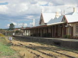 Another look to the southwest of the barracks back to Cooma station and platform.