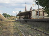 A look south between the main and loop lines toward Cooma station and the signals beyond.