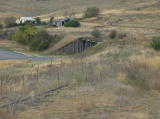 Another look northwest over the railway bridge towards Cooma station. The weeds have taken over, but the line is still visible.