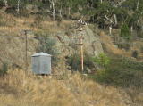 A close up of the railway signal and shed on the eastern bank of Cooma Creek. The structures appear to be in good condition.