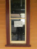 Rylstone railway station, with a sign in the window: No cash or valuables left on site ever!