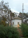 A couple of small huts on the down side of Binalong station.