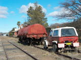 The hi-railer is parked in front of the water gin at Michelago station.