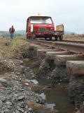 Scouring of the track base and remaining flood water, on the down side of the railway line, near 343.4km.