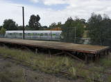 A restored railcar just out of Queanbeyan station.