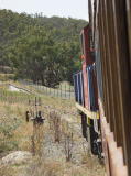The train approaches the old Tuggeranong platform. Levers that control the points to the platform can be seen on the left.