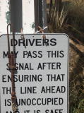 Detail of the sign at the bottom of the signals north of Royalla station. The sign indicates that drivers may proceed if the line ahead is unoccupied.
