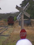 Diesel 7319 at the north end of the loop line at Royalla. Railway crossing signage can be seen in the foreground.