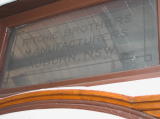 Ritchie Brothers glass sign at one end of a carriage.