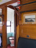 Another look inside a railway carriage. We can see the entrance to the toilet compartment.