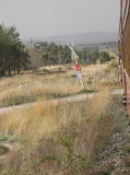 The train crosses Arnott Street again heading north to Queanbeyan.