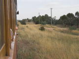 An industrial siding joins the main line just north of the Arnott Street crossing.