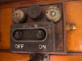 Detail of light switches inside one of the railway carriages. The fitting is marked J Stone & Co. Ltd, London.