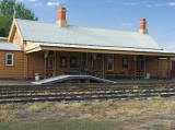 The eastern part of the Yass railway station. A pile of suitcases can be seen behind a small ramp.